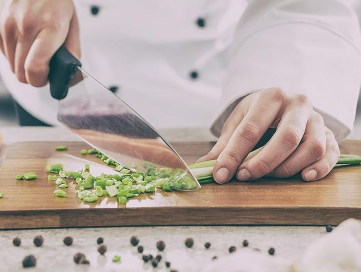 cook cutting onions